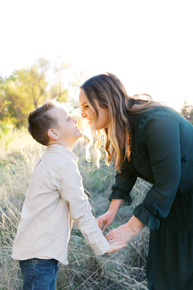 mom and son smiling at each other