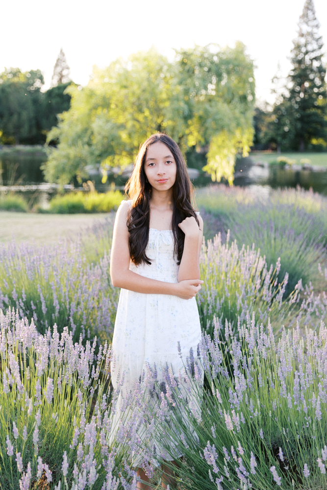 Woman standing in a blooming lavender field, one of the best locations for family photos in Sacramento in early summer