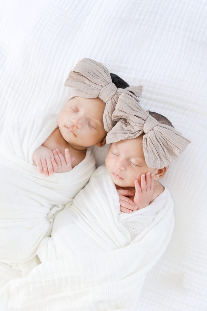twin baby girls sleeping side-by-side