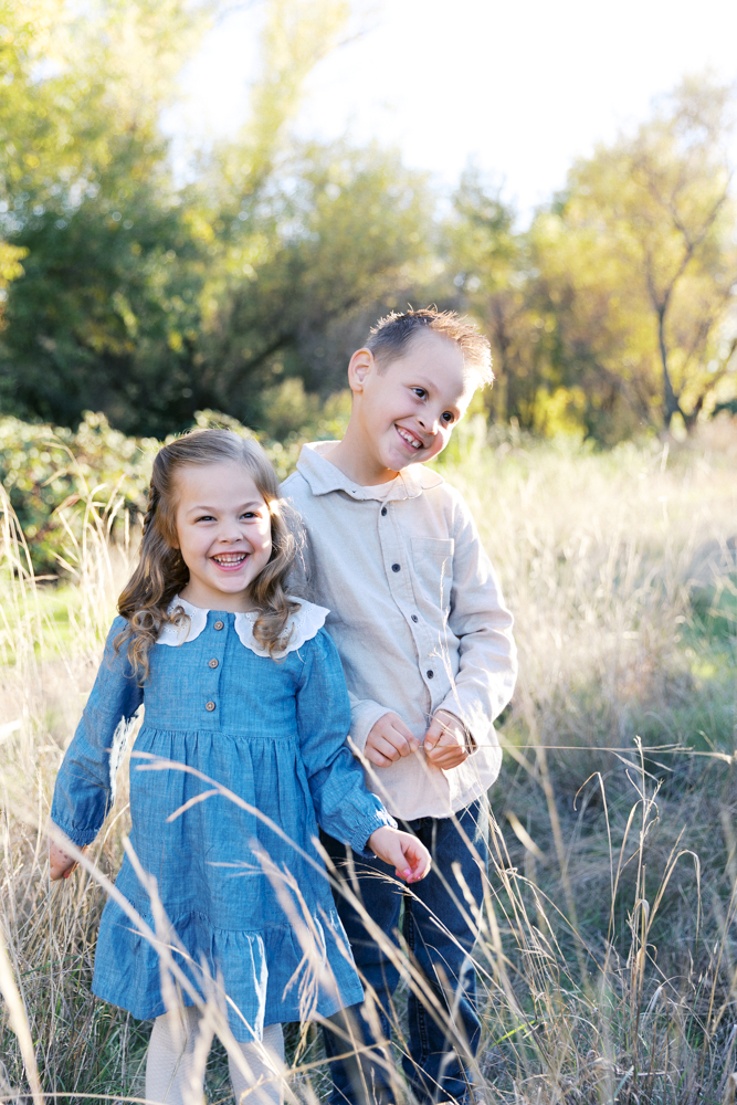 brother and sister laughing