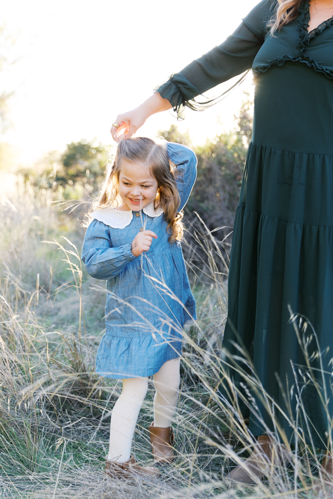 mother spinning daughter in circles